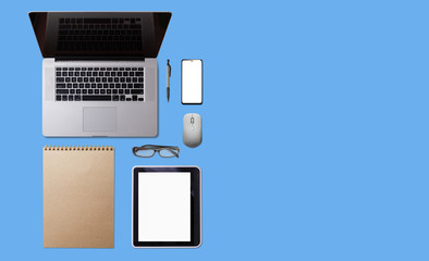 business office desk with workspace, cell phone, tablet, coffee cup, notebook, pencil, on blue pastel background