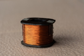 The coil of the magnetic starter. In the copper winding, the current is given and the magnetic induction arises