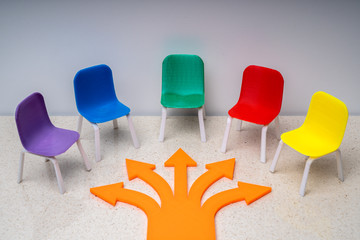 Empty Small Chairs And Arrows