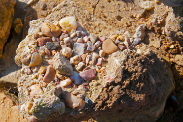 Different small stones inside big one. Close view.