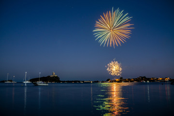 Fireworks over the sea of Nora bay, Sardinia