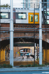 Sydney, Australia - 24 Feb 2020: Train travelling above the overpass along Eddy Ave in near Central Railway station which is one the main public transport interchanges in the city centre.