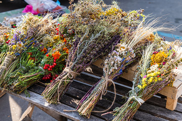 Kyiv, Ukraine bazaar food market in Kiev city with vendor selling dried flower bouquets on table