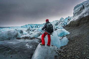 Person looking at how the glaciers thaw due to climate change