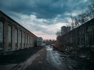 Depressive territory of abandoned industrial area, old warehouses