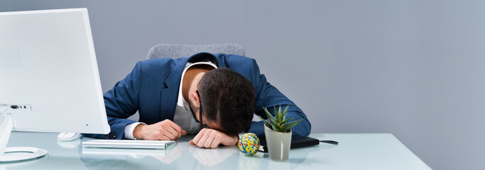 Tired Businessman Sleeping In Office