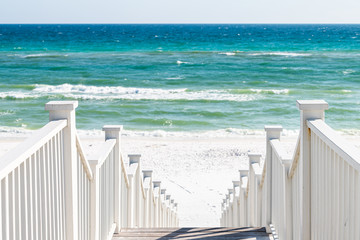 Seaside, Florida railing wooden stairway walkway steps architecture by beach ocean background view down during sunny day © Andriy Blokhin