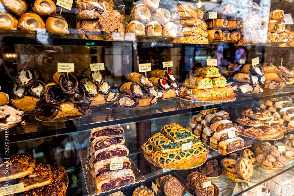 Wall mural pastry bakery store shop in assisi, umbria italy selling dessert chocolate cannoli, rocciata cakes a