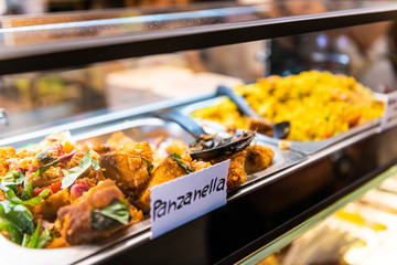 Sign for panzanella Italian traditional soaked bread salad with vegetables in market shop grocery...