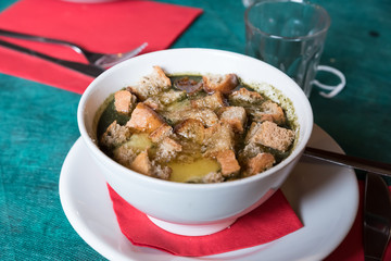 Trentino vegetable soup with melted cheese