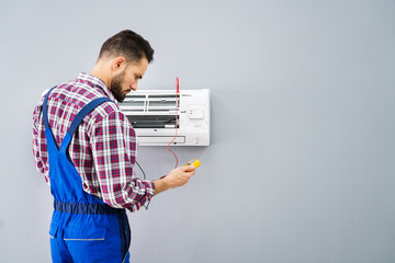Technician Testing Air Conditioner