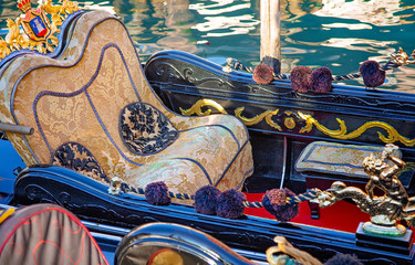 Luxury Gondola waiting for tourists near famous Rialto Bridge in Venice