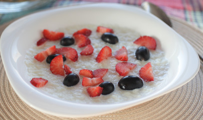 rice porridge with strawberry and grapes
