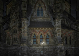 Gothic building lit at night Canada parliament library nobody
