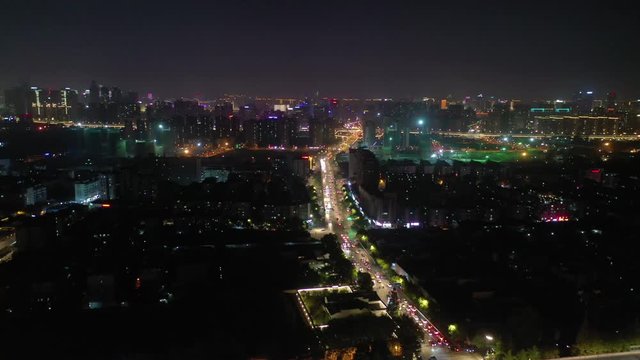 night time illuminated hangzhou cityscape traffic street road aerial panorama 4k china