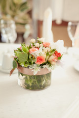 Decoration of a table. Bouquet of flowers on a table.