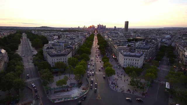 Paris streets seen from above, panoramic view. Sunset light. top of Arc de Triomphe. Tourism attraction & famous landmark in France. Romantic honeymoon travel destination.