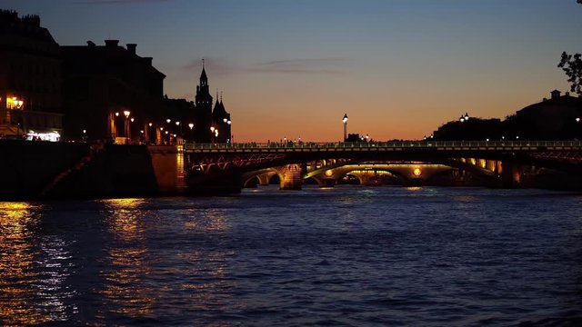 Paris at night, Seine River Bridge. illuminated with lamppost streetlamp. Tourism attraction & famous landmark in France. Romantic honeymoon travel destination.