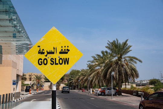 Yellow Go Slow Road Sign