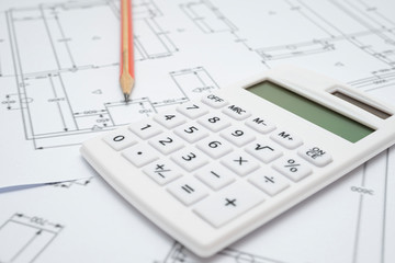  Architectural drawing, calculator and pencil