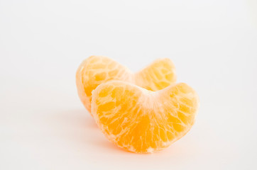 Pair of mandarin orange segments on white background