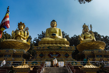Fototapeta na wymiar The Golden Buddha Statues in Buddha park, Swayambhunath area, Kathmandu, Nepal
