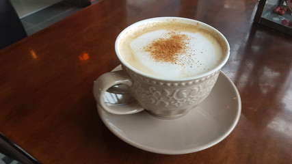 coffee cappuccino cinamon and sugar on the top