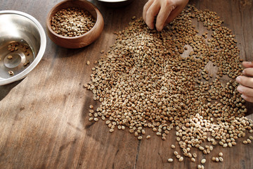 roasted coffee beans in bowl on wooden