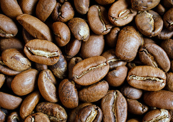 roasted coffee beans in bowl on wooden