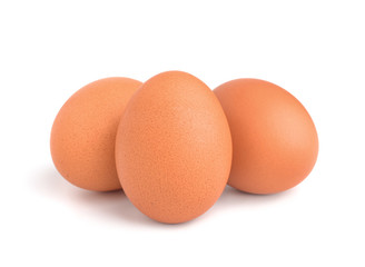 Raw chicken eggs isolated on the white background.