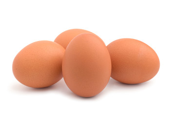 Raw chicken eggs isolated on the white background.