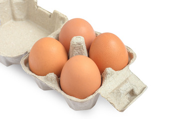 Close-up view of raw chicken eggs in egg box isolated on white background,Used for cooking.