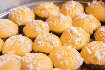 Toddy Palm Cake (Ka-nom Tarn) in Steaming pot in a market. Thai dessert