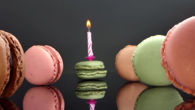 spread macaroons and a burning candle for the holiday