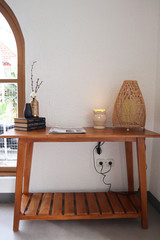 Aesthetic interior. Wooden table with bamboo lamp and decoration