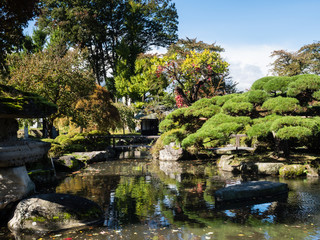 Fototapeta na wymiar Traditional Japanese public garden near reconstructed Takashima castle in Suwa, Nagano prefecture, Japan