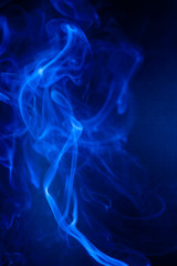 Blue smoke motion on black background.