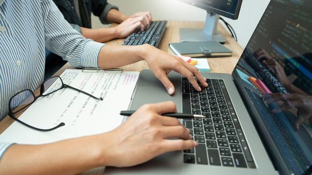 Team of programmers working together development Website design and coding technologies in a software develop company office, Coworkers Team concept