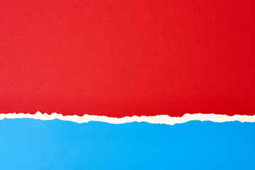 Torn ripped paper edge with a copy space, red and blue color background
