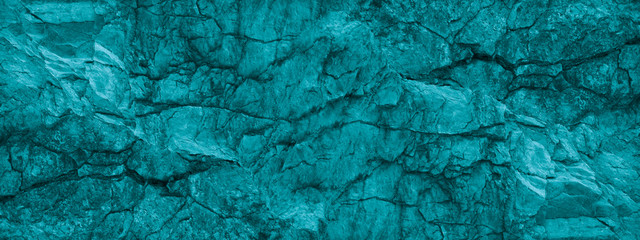 Blue green stone background. Underwater rocky texture. Close-up. Toned mountain texture. 