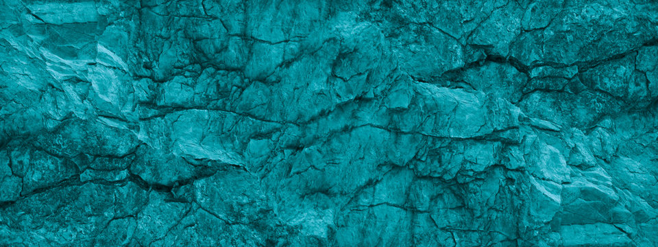 Blue green stone background. Underwater rocky texture. Close-up. Toned mountain texture. 
