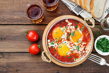 Shakshuka (menemen) fried eggs in tomato sauce for turkish breakfast.