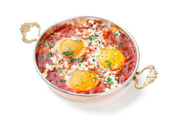 Shakshuka (menemen) fried eggs in tomato sauce for turkish breakfast. isolated on white background