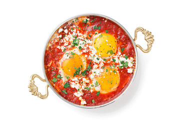 Shakshuka (menemen) fried eggs in tomato sauce for turkish breakfast. isolated on white background