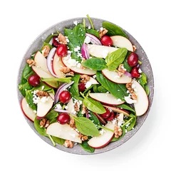 Gordijnen Homemade salad with fresh baby spinach, red apple, cranberry, walnuts and feta cheese. isolated on white background © Nelea Reazanteva