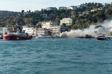 Rescue boats extinguish a fire on a passenger ship in the Bosphorus Strait. Istanbul