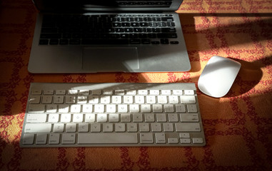Laptop with wireless keyboard and mouse. Work from home.