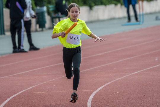 Isolated eleven year old girl in a track and field relay race- Israel