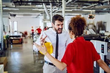 Angry caucasian bearded director in shirt and tie arguing with his sloppy female employee. Printing...