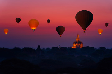 Sunrise many hot air balloon in Bagan, Myanmar. Bagan is an ancient with many pagoda of historic buddhist temples and stupas.
